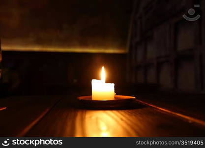 candle in dark room close up