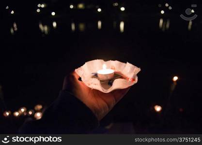 Candle in the hands