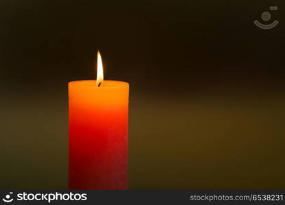 Candle light with flame. Candle light with flame on dark soft background