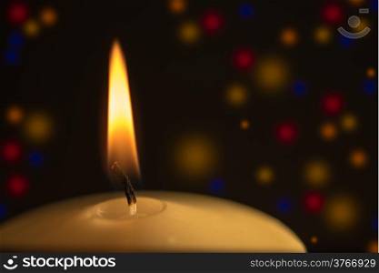Candle with colored light background