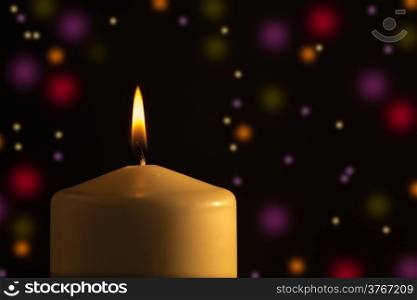 Candle with colored light background