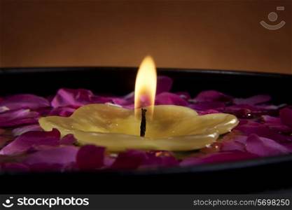 Candle with flower petals