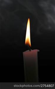 candle with smoke on the isolated black background