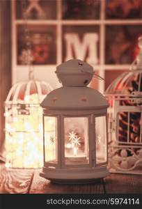Candlelight and birdcage decorations in shabby chic style. Christmas light