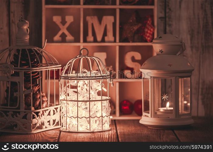 Candlelight and birdcage decorations in shabby chic style. Christmas light