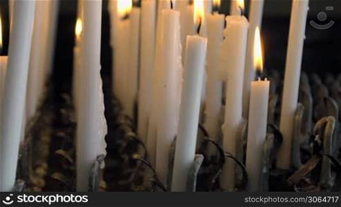 Candles burning in catholic church