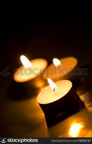 candles burning in the dark