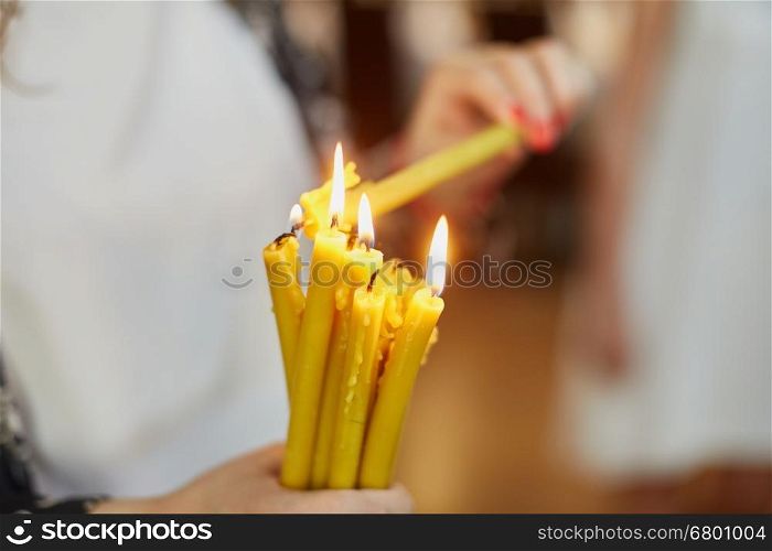 Candles during orthodox christening baptism. Orthodox church