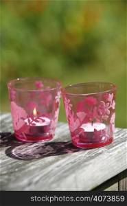 Candles in pink glasses