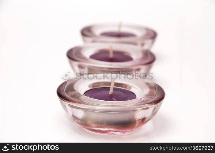 candles lilac color design with a glass cup