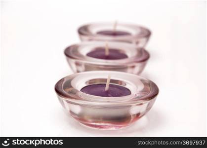 candles lilac color design with a glass cup