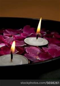 Candles with flower petals