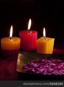 Candles with flower petals