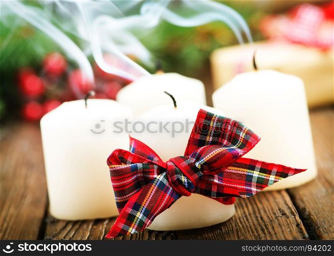 candles with ribbon on a table, christmas decoration