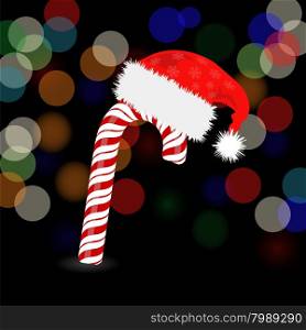 Candy Cane and Hat of Santa Claus. Candy Cane and Hat of Santa Claus 0n Dark Blurred Background