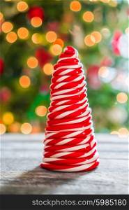 Candy cane tree on wooden background