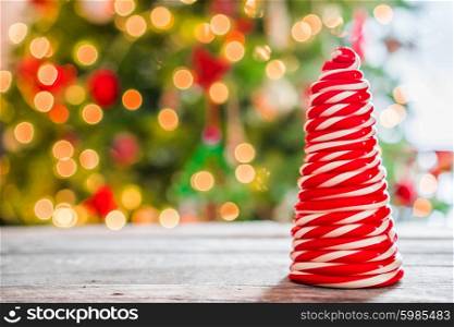 Candy cane tree on wooden background