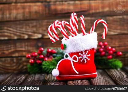 candy canes and christmas decoration on a table