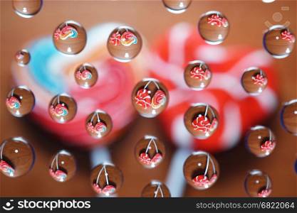 Candy heart shaped picture in water drops