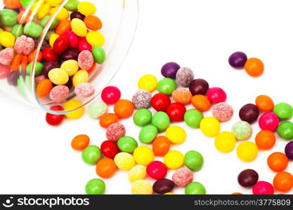Candy in a glass jar on white background