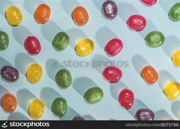 Candy scattered on the wooden table