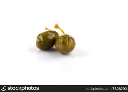 Canned capers on a white background close up
