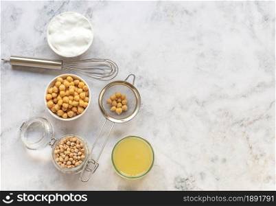 Canned chickpea water aquafaba. Egg replacement and substitutes. Vegan, sustainable lifestyle, and natural eco-friendly products.