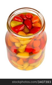 canned peppers in a glass jar isolated on white background