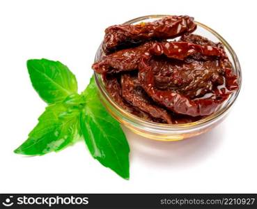 Canned Sundried or dried tomato halves in glass bowl on white background. Canned Sundried or dried tomato halves in glass bowl