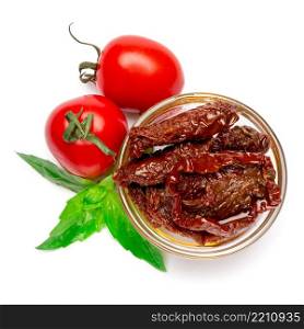 Canned Sundried or dried tomato halves in glass bowl on white background. Canned Sundried or dried tomato halves in glass bowl