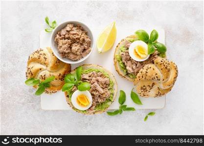 Canned tuna open sandwiches. Buns burgers with canned tuna, boiled egg and avocado