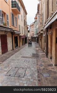 CANNES, FRANCE - NOVEMBER 3, 2014: Tourists on the old street