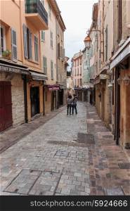 CANNES, FRANCE - NOVEMBER 3, 2014: Tourists on the old street