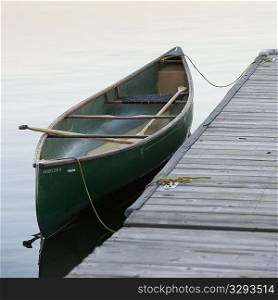 Canoe by a dock in Lake of the Woods, Ontario