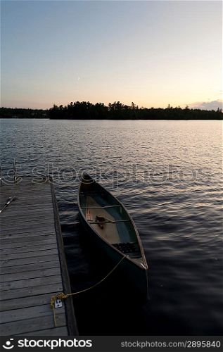 Canoe moored at a dock, Lake of the Woods, Ontario, Canada