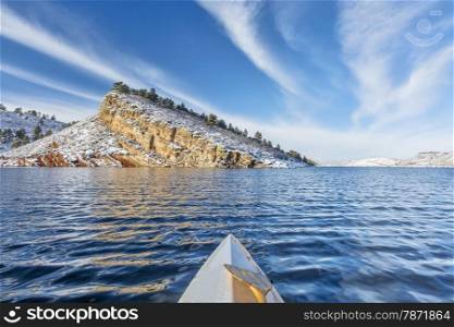 canoe paddling on Horsetooth Reservoir near Fort Collins in northern Colorado, winter scenery