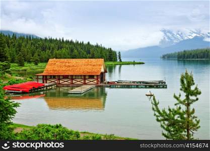 Canoes at boathouse on Maligne Lake in Jasper National Park, Canada