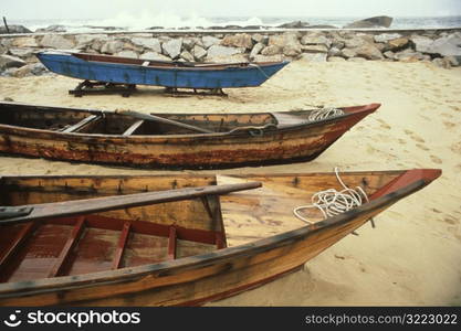 Canoes On A Sandy Beach