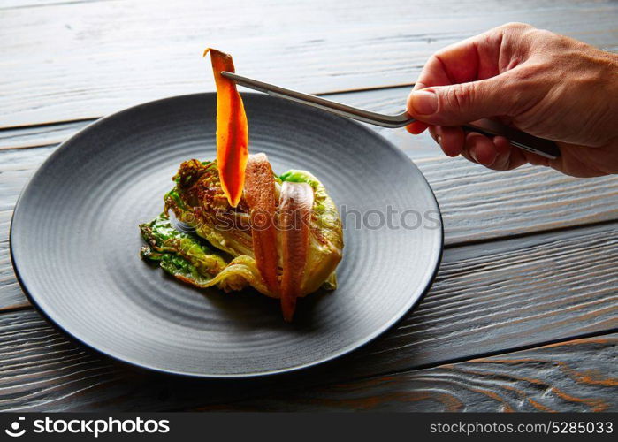 Cantabrian anchovies with endive chef hand preparation