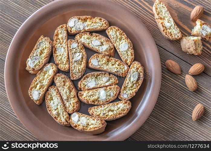 Cantuccini on the plate on wooden background