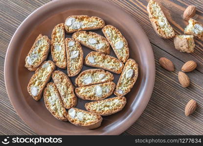 Cantuccini on the plate on wooden background