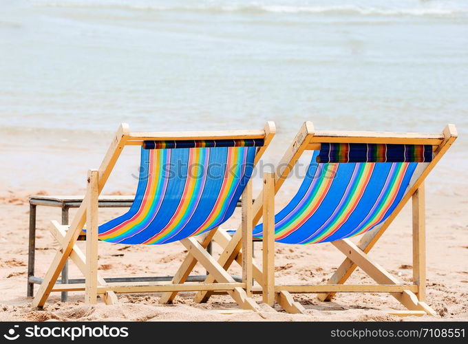 Canvas wooden bed on the lonely beach in summer time.