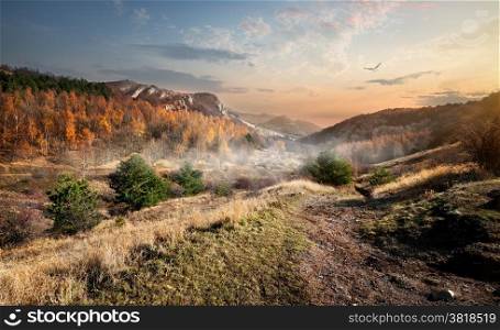 Canyon and fog in mountains in the autumn