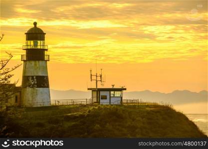 Cape Disappointment Lighthouse at sunrise, built in 1856, Pacific coast, WA, USA