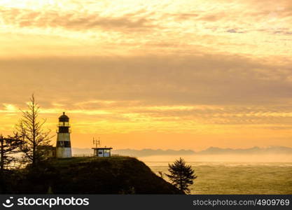 Cape Disappointment Lighthouse at sunrise, built in 1856, Pacific coast, WA, USA