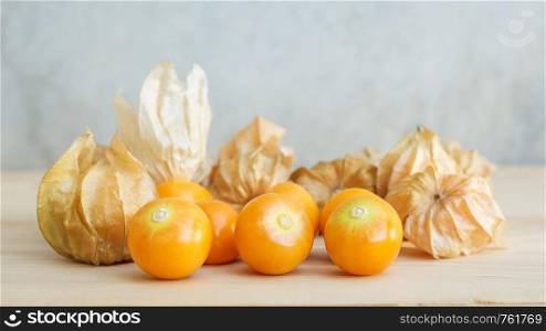 Cape gooseberry on wooden background.