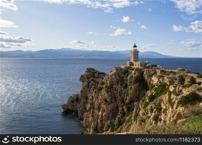 Cape Melagkavi Lighthouse also known as Cape Ireon Light on a headland overlooking eastern Gulf of Corinth, Greece.. Cape Melagkavi Lighthouse also known as Cape Ireon Light