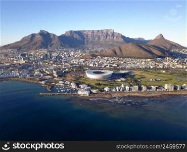 Cape Town, South Africa - 19 April 2022  Aerial view over Cape Town, with Cape Town stadium and Table Mountain .