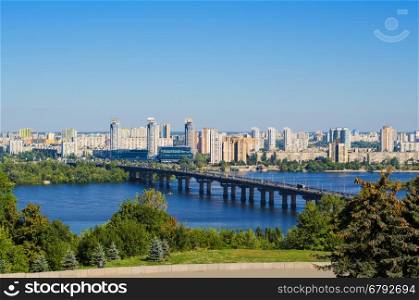Capital of Ukraine - Kiev. Paton bridge and new residential district on the left coast of Dnieper in Kyiv