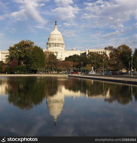 Capitol Building and reflection in water in Washington, DC, USA.